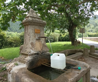 Collecting water from the village fontaine