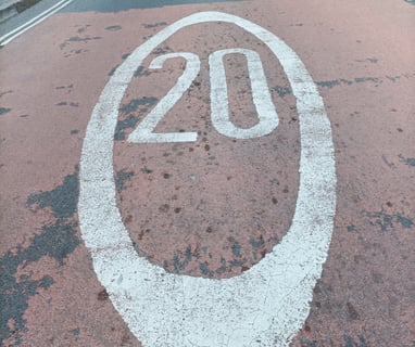 2Om.p.h. speed limit throughout town