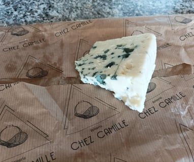 Roquefort cheese , made exclusively from local  sheeps milk 