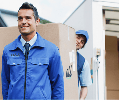 a man in a blue jacket and tie dyes a tie