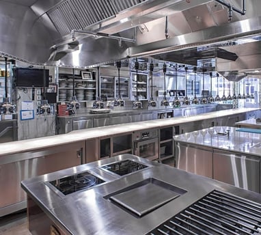 a kitchen with a stove top and a stove top