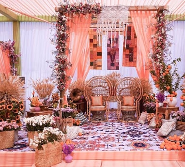 a wedding ceremony with a floral arrangement of flowers and flowers