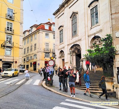 Beautiful street in Portugal with people going about their business 