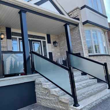 frosted glass railings with columns in driveway