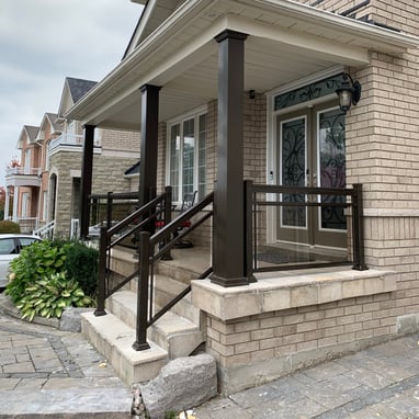 front porch with brown collumns improve the look of the house