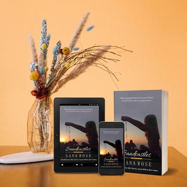 Sandcastles book near flower vase