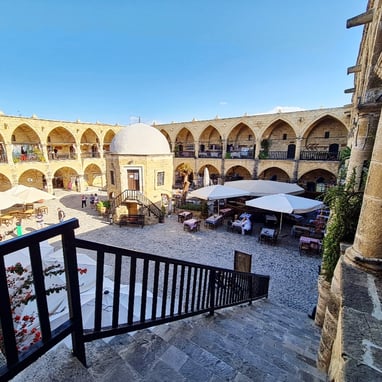 North Cyprus a view of a courtyard with tables and umbrellas
