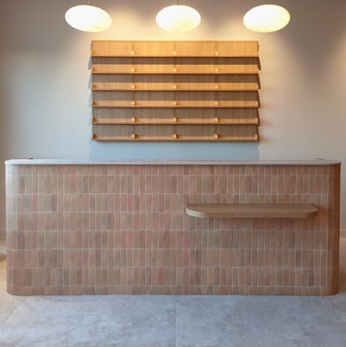 a counter top with a shelf with shelves and shelves