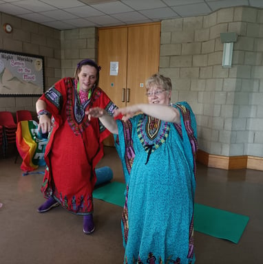 Two people performing a creative dance