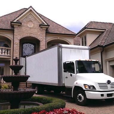 Full Service Moving Truck in front of a Home 