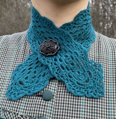 a woman wearing a blue neck tie and a blue neck tie
