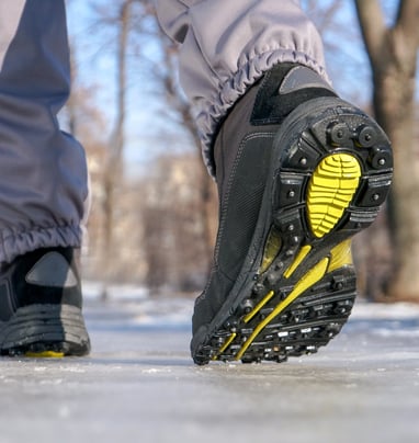 a person walking on a snow covered ground
