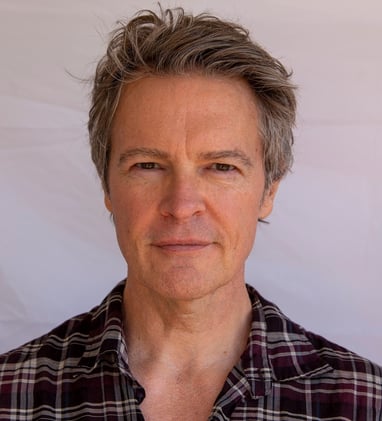Headshot of Todd Long with short-medium hair