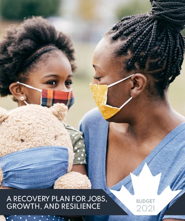 a woman in a blue shirt and a child in a blue shirt and a teddy