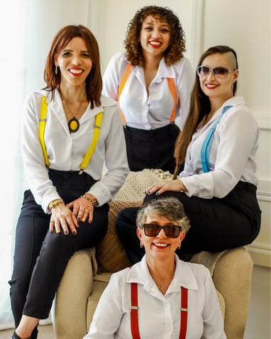 a group of women sitting on a couch