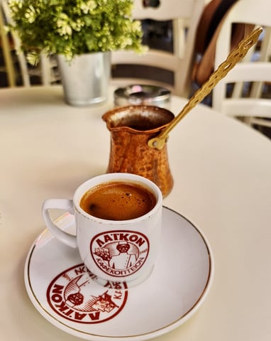 Cyprus coffee a cup of coffee with a spoon and a spoon in it