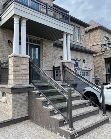 front stairway with grey tinted glass railings