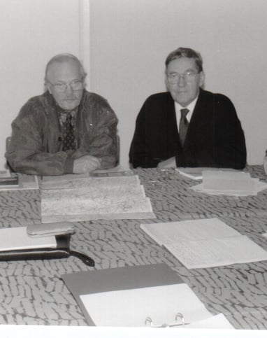 a group of people sitting around a table