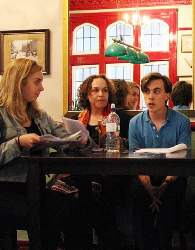 Actors performing a sitcom table read at a London Comedy Writers meeting