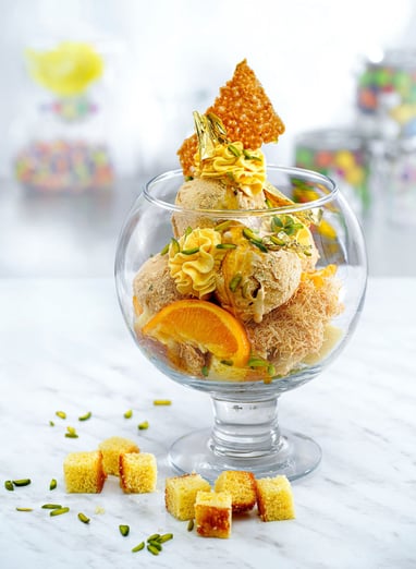 a dessert with oranges and a dessert