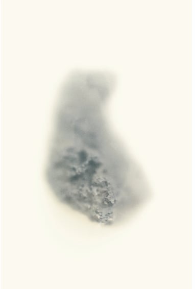 a photograph of a stone. Partly obscured by mist