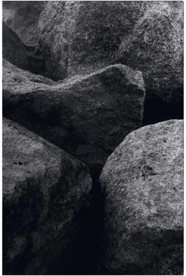 a close up photograph of several boulders. Abstract