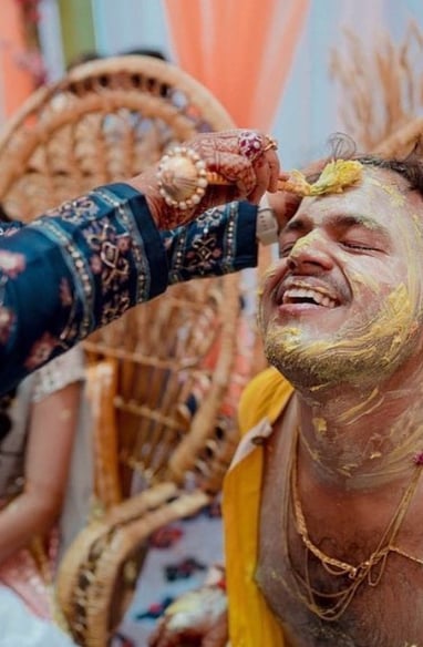 a man with a beard and a woman with a yellow face paint on his face