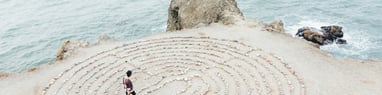 Woman walking in the labyrinth. Tracking emotions is a way to improve emotional well-being.