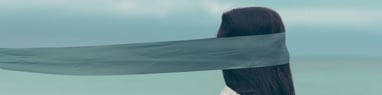 A blindfolded woman. How to recognise burnout? Mindletic Blog