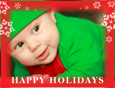 a baby wearing a green elf hat and a green elf hat