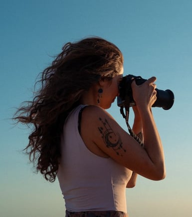 a woman taking a picture with a camera