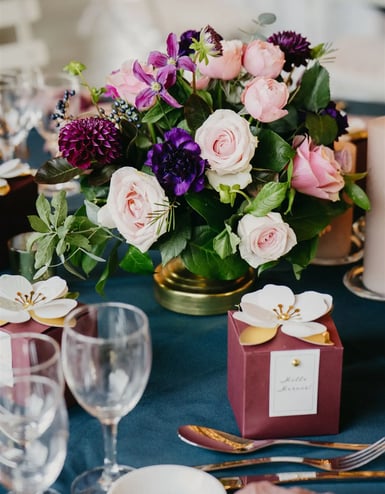 Luxury editorial wedding table detail with floral centerpiece in Provence