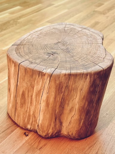 a wooden table with a wooden stump