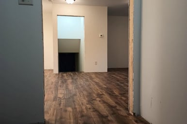 New vinyl laminate flooring was spread throughout this house in Goshen, IN, while being remodeled.