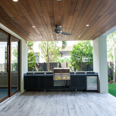 showing of a back patio with a large outside grill and sink and refrigerator