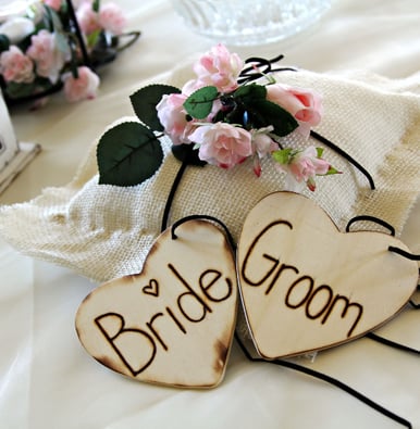 bride and groom is written on the wooden piece