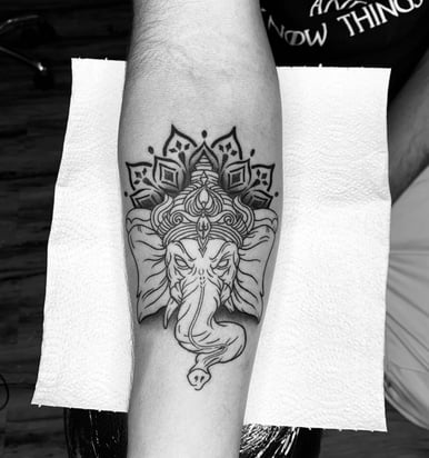 Black and Grey Ganesha tattoo with mandala design by tattoo artist at Dudo’s in Hyderabad