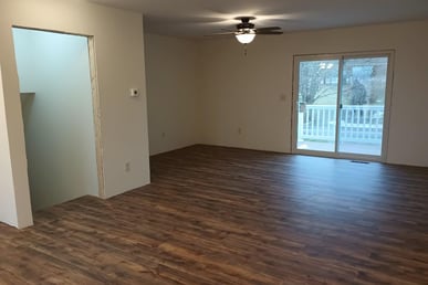 New vinyl laminate flooring was spread throughout this house in Goshen, IN, while being remodeled.