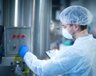 a man in a lab coat and a mask on