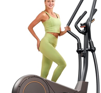 a woman in a green outfit is standing on a stationary stationary bike