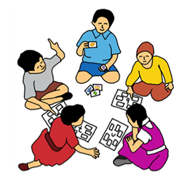 a group of people sitting around a table with puzzles