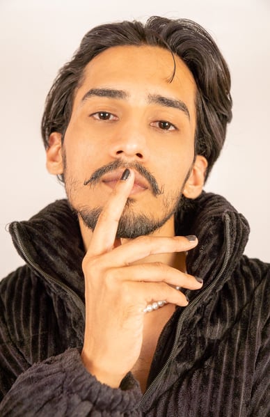 a man with a mustache and a mustache on his finger