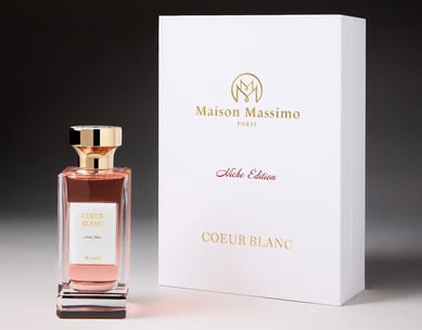a bottle of perfume with a box of perfume