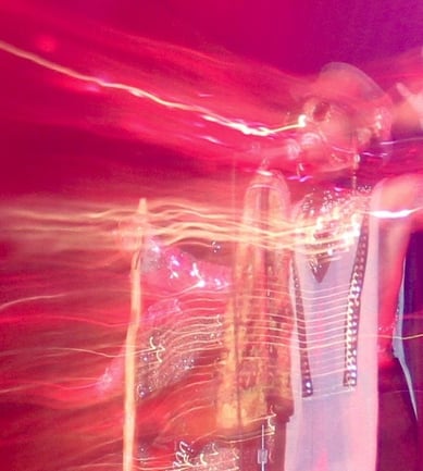 Live concert performance with visual effects on singer
