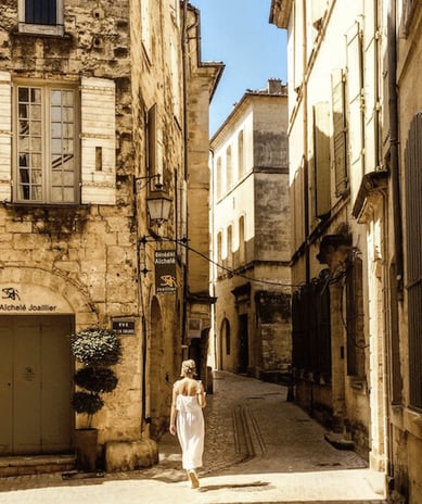 Woman walking in Provence village streets Saint Remy de Provence