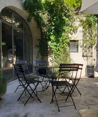 a patio table with chairs and a table