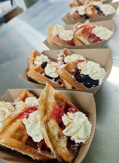 Signature Waffle with Berry Compote Maple Syrup and Whipped Cream