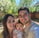 a man and woman taking a selfie with a baby