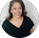 a woman in a black shirt and black top showing review for ooty honey wild