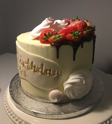 a cake with a chocolate cake and strawberries on top